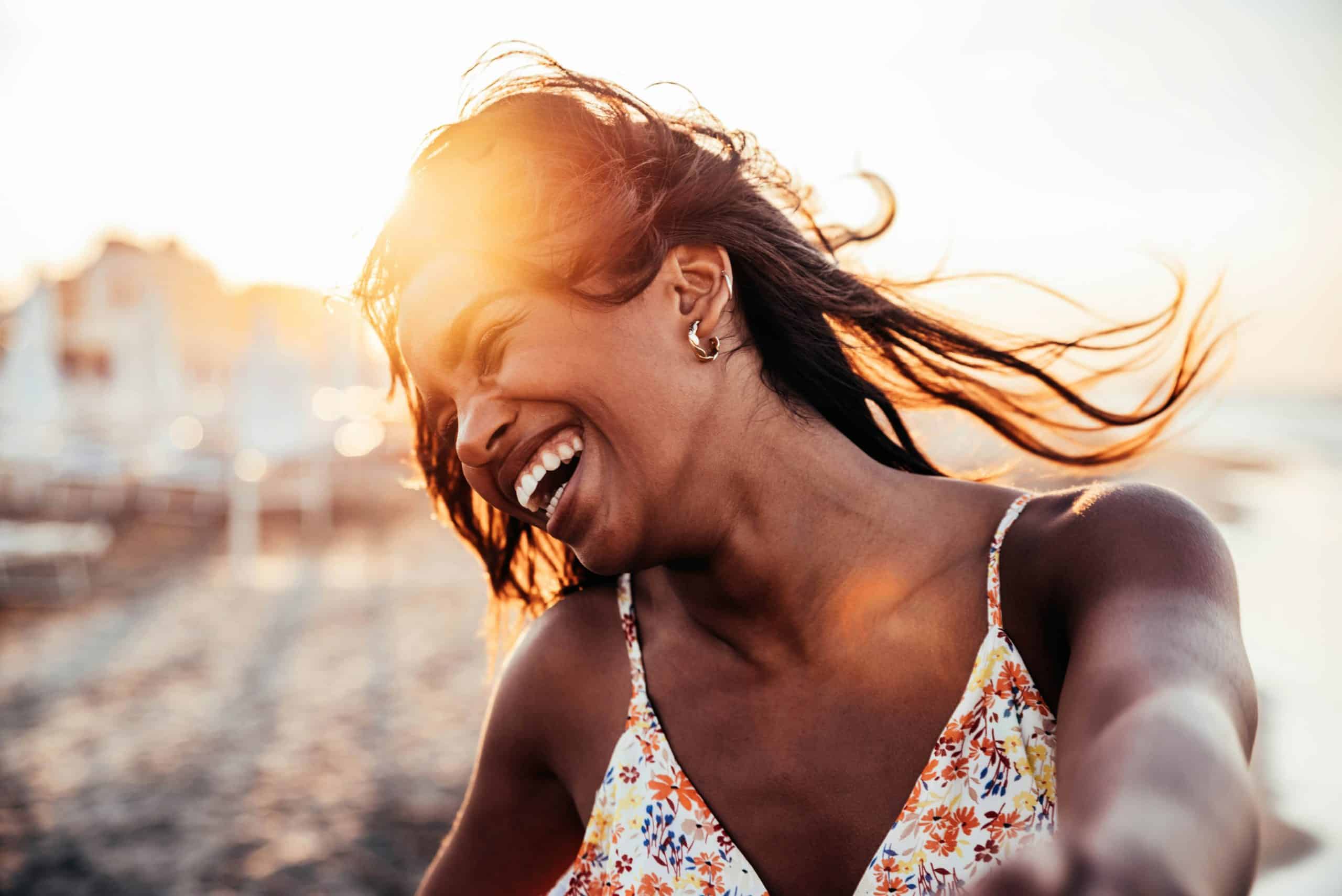 Happy woman enjoying a peaceful outdoor beach moment